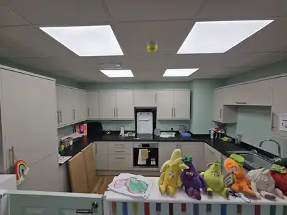 Completed kitchen and preparation area with new lighting and electrical installation
